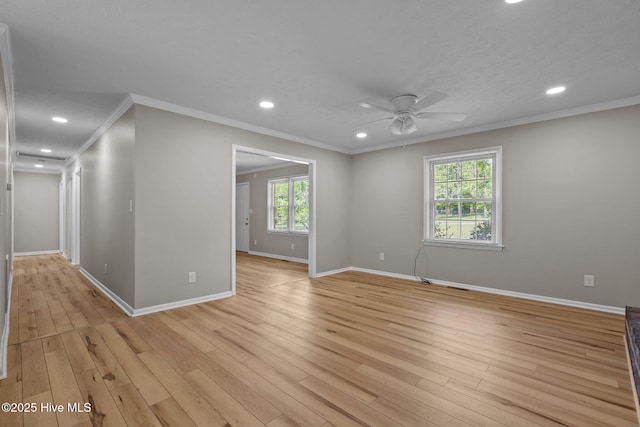 spare room with recessed lighting, a ceiling fan, baseboards, ornamental molding, and light wood-style floors