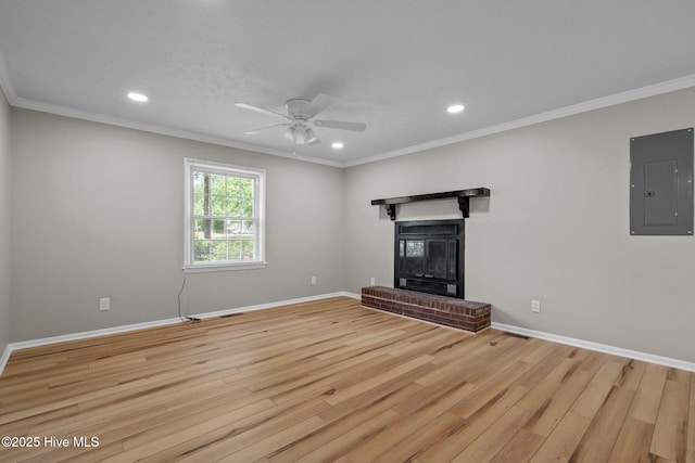 unfurnished living room featuring electric panel, light wood-style floors, a ceiling fan, baseboards, and recessed lighting