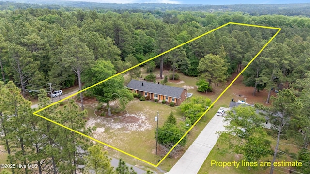 view of subject property featuring a forest and property boundaries highlighted