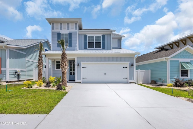 view of front of property with board and batten siding, concrete driveway, and a garage