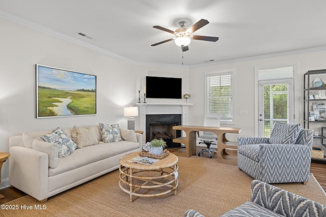 160 Freedom Park Rd, Beaufort, NC 28516 - living area with ornamental molding, a ceiling fan, a fireplace, and wood finished floors
