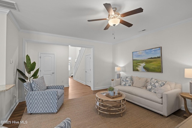 160 Freedom Park Rd, Beaufort, NC 28516 - living room featuring wood finished floors, baseboards, crown molding, and a ceiling fan