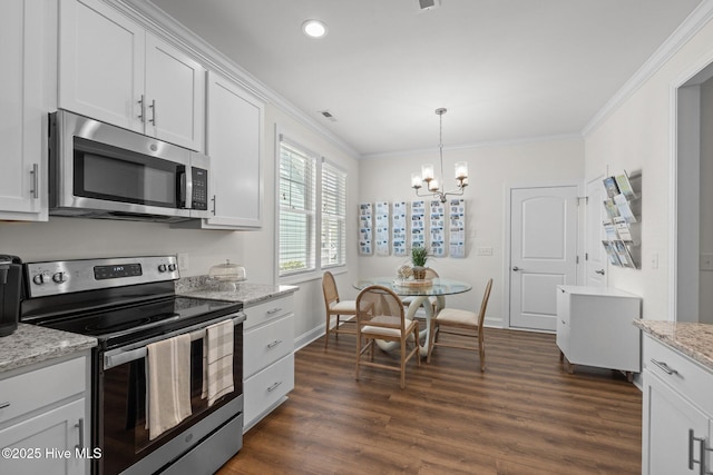 160 Freedom Park Rd, Beaufort, NC 28516 - kitchen with appliances with stainless steel finishes, crown molding, a chandelier, dark wood-style floors, and white cabinets