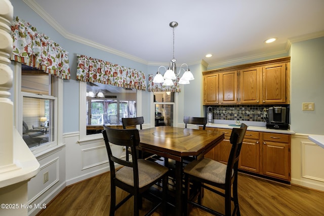 1992 Acorn Dr, New Bern, NC 28562 - dining space with dark wood-style floors, ornamental molding, a chandelier, and recessed lighting