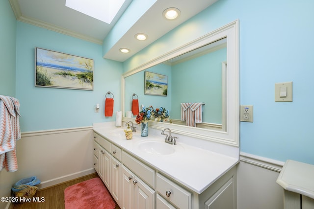 1992 Acorn Dr, New Bern, NC 28562 - full bath featuring double vanity, a skylight, wood finished floors, crown molding, and recessed lighting