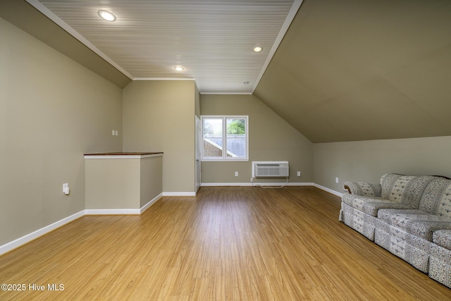 1992 Acorn Dr, New Bern, NC 28562 - unfurnished living room with an AC wall unit, vaulted ceiling, wood finished floors, and recessed lighting