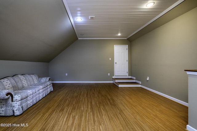 1992 Acorn Dr, New Bern, NC 28562 - unfurnished living room with lofted ceiling, wood finished floors, and recessed lighting