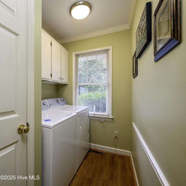 1992 Acorn Dr, New Bern, NC 28562 - washroom with washer and dryer, cabinet space, ornamental molding, and dark wood-type flooring