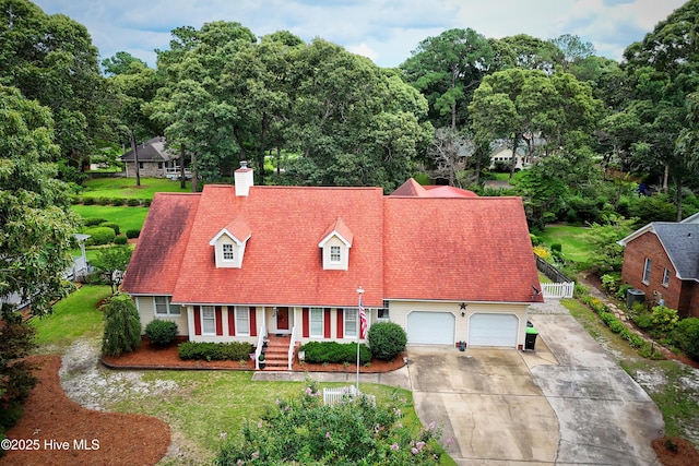 1992 Acorn Dr, New Bern, NC 28562 - cape cod house with concrete driveway, a chimney, and a front lawn