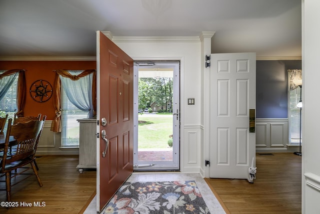 1992 Acorn Dr, New Bern, NC 28562 - entrance foyer with a decorative wall, wood finished floors, crown molding, and wainscoting