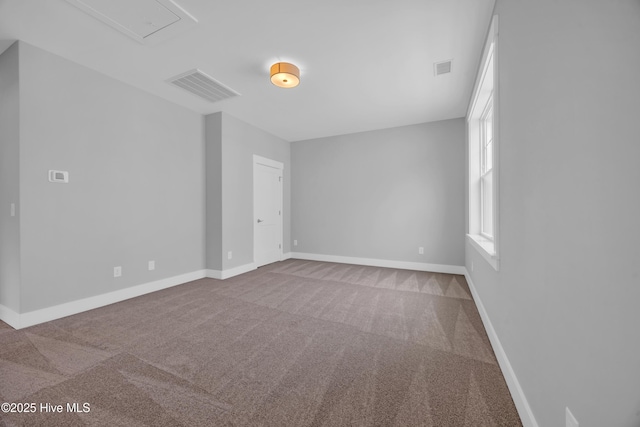 empty room with carpet floors and baseboards