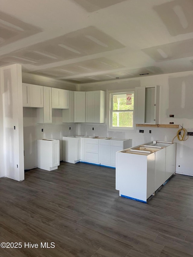 169 Howard Rd, Newport, NC 28570 - kitchen with white cabinetry and dark wood-type flooring