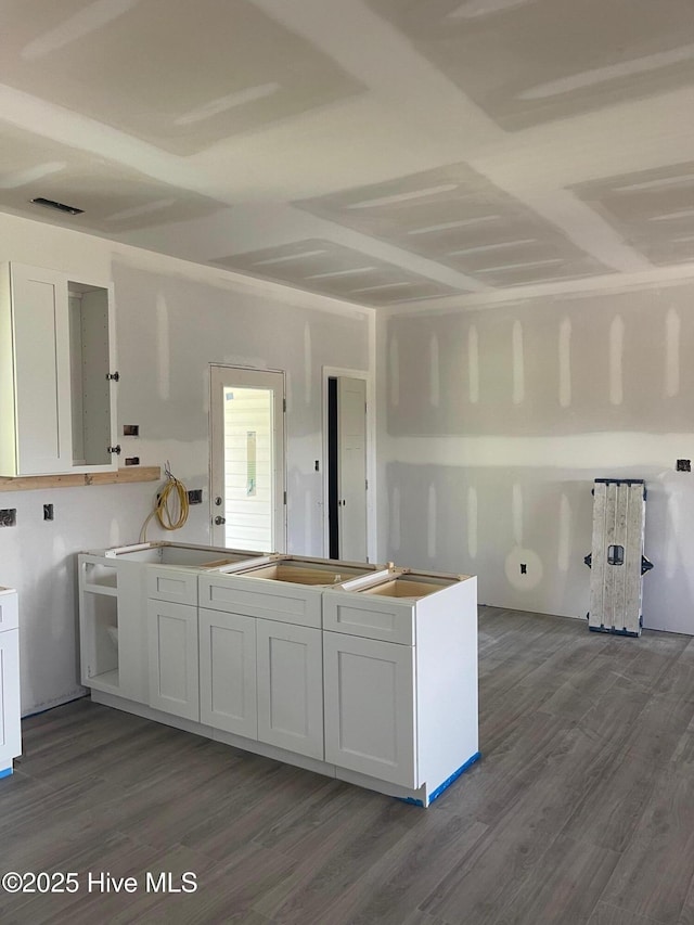 169 Howard Rd, Newport, NC 28570 - kitchen with dark wood finished floors and white cabinets