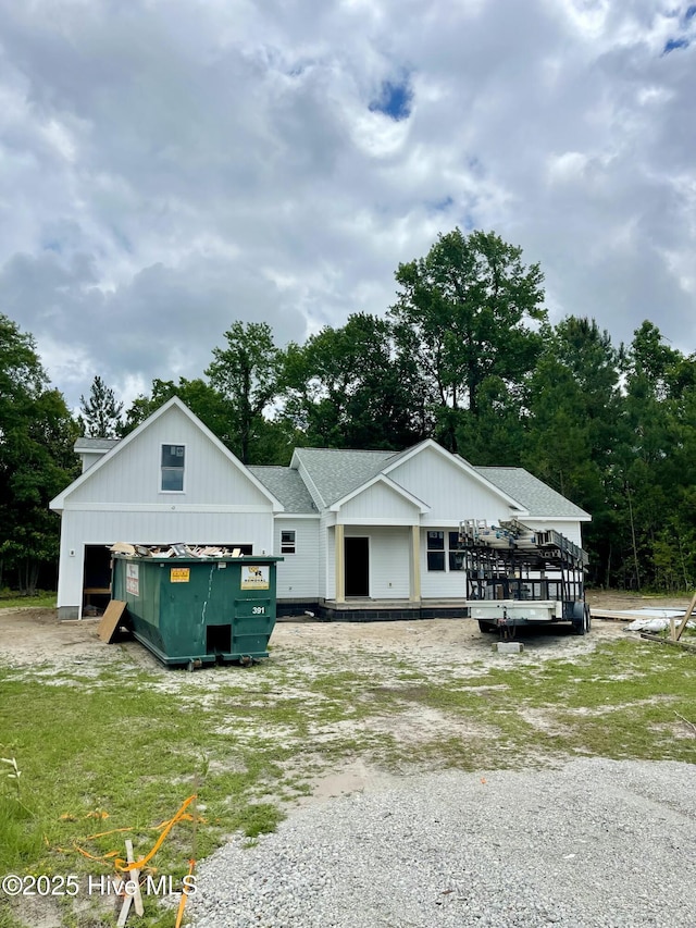 169 Howard Rd, Newport, NC 28570 - view of front of property with roof with shingles, view of scattered trees, and a deck
