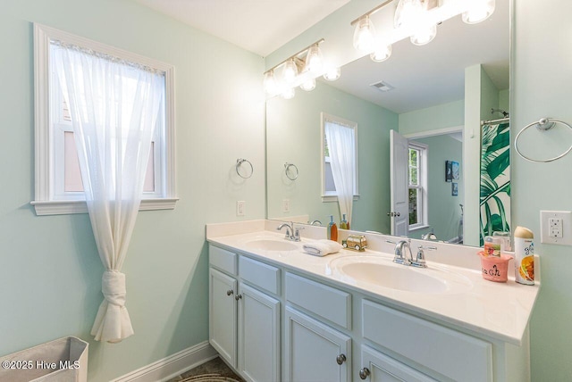 227 NE 38th St, Oak Island, NC 28465 - bathroom featuring double vanity