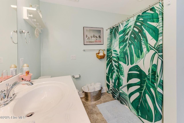 227 NE 38th St, Oak Island, NC 28465 - bathroom with vanity and a shower with curtain