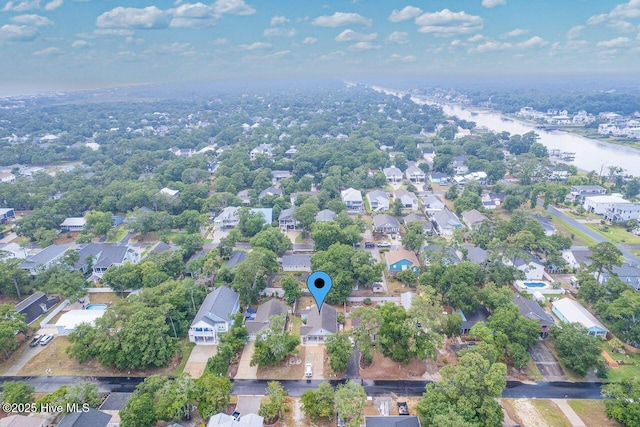 227 NE 38th St, Oak Island, NC 28465 - aerial perspective of suburban area with a large body of water