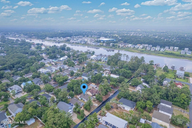 227 NE 38th St, Oak Island, NC 28465 - aerial overview of property's location featuring a nearby body of water and nearby suburban area
