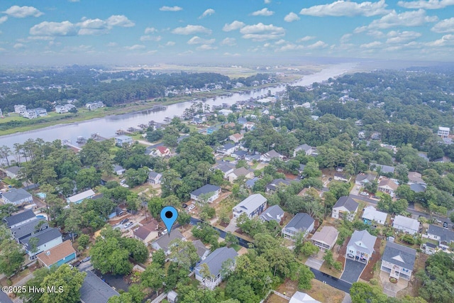 227 NE 38th St, Oak Island, NC 28465 - aerial view of property and surrounding area with a large body of water and nearby suburban area