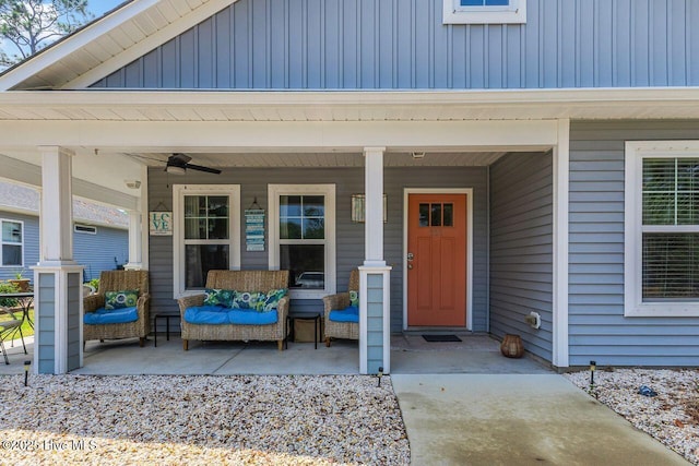 227 NE 38th St, Oak Island, NC 28465 - view of exterior entry featuring covered porch and a ceiling fan
