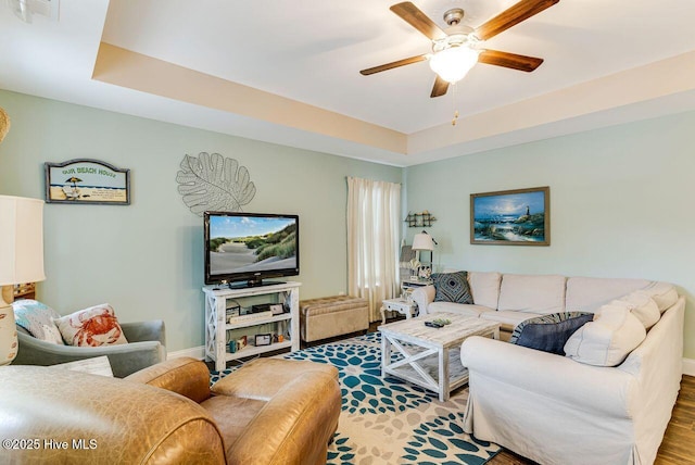 227 NE 38th St, Oak Island, NC 28465 - living area featuring a ceiling fan and wood finished floors