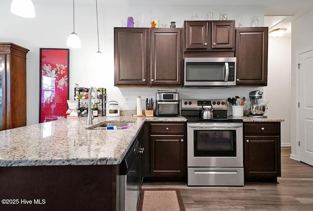 1807 St Patricks Ct SE Lot 267, Bolivia, NC 28422 - kitchen featuring stainless steel appliances, a sink, a peninsula, and dark brown cabinetry