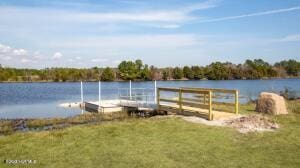 1807 St Patricks Ct SE Lot 267, Bolivia, NC 28422 - dock area featuring a water view and a yard