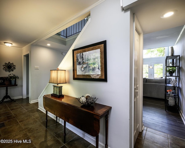 302 Plantation Dr, New Bern, NC 28562 - hall featuring baseboards, stairs, dark tile patterned floors, and crown molding