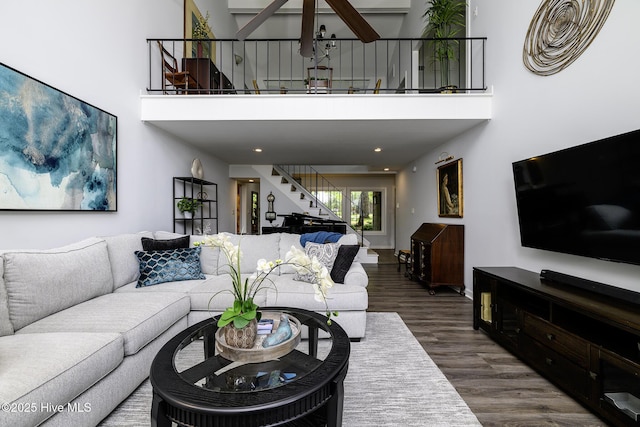 302 Plantation Dr, New Bern, NC 28562 - living area with stairway, wood finished floors, and a towering ceiling