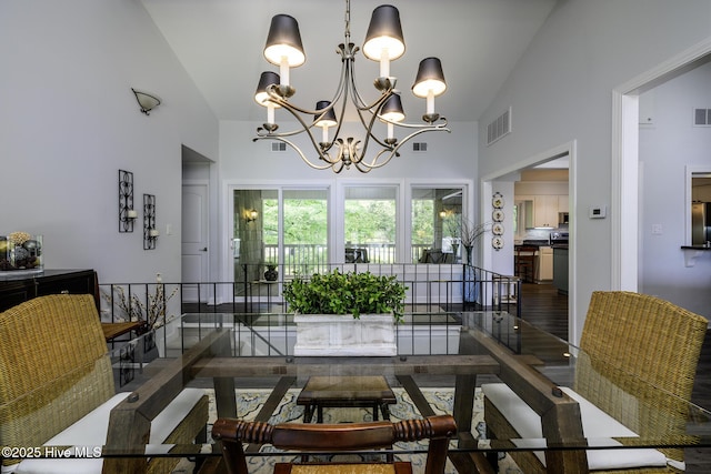 302 Plantation Dr, New Bern, NC 28562 - dining room featuring high vaulted ceiling, a chandelier, and wood finished floors