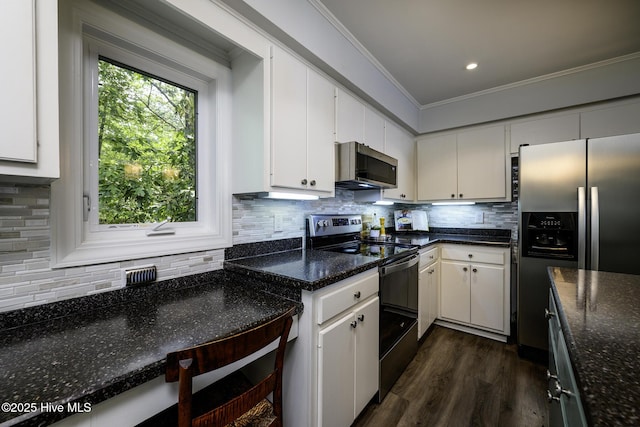 302 Plantation Dr, New Bern, NC 28562 - kitchen featuring stainless steel appliances, ornamental molding, dark wood-style floors, white cabinets, and recessed lighting