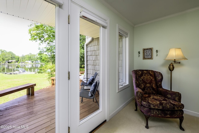 302 Plantation Dr, New Bern, NC 28562 - sitting room featuring a water view, ornamental molding, and baseboards