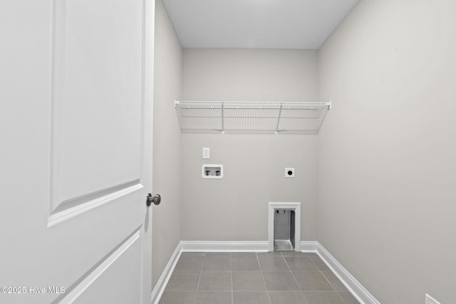 206 Ethan Pl, Hubert, NC 28539 - laundry room featuring hookup for an electric dryer, baseboards, hookup for a washing machine, and tile patterned flooring