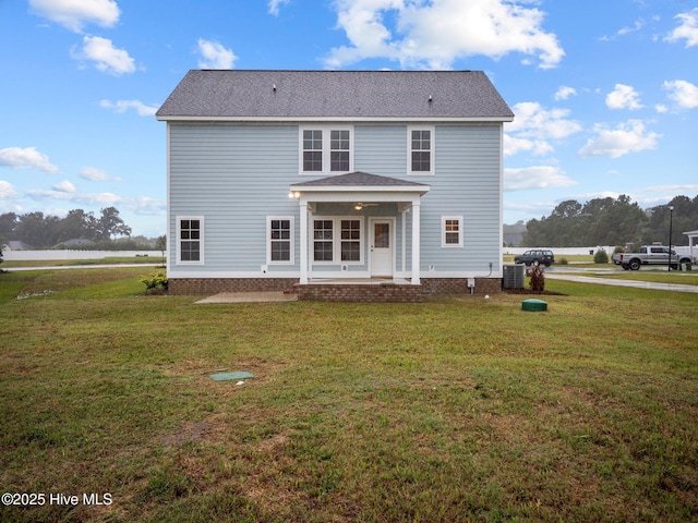 206 Ethan Pl, Hubert, NC 28539 - rear view of property featuring a yard, a patio, and roof with shingles