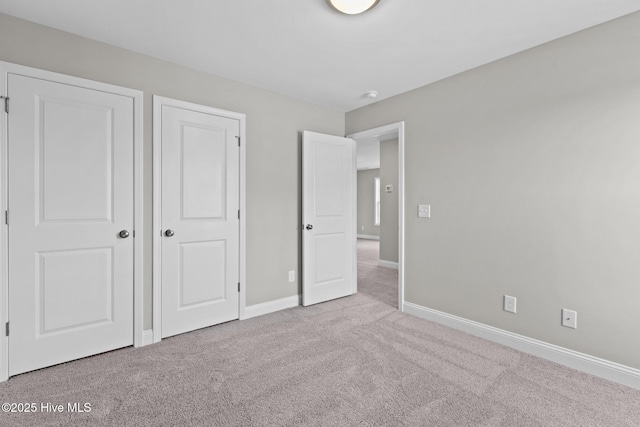206 Ethan Pl, Hubert, NC 28539 - unfurnished bedroom featuring carpet flooring and baseboards