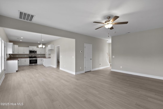 206 Ethan Pl, Hubert, NC 28539 - unfurnished living room with ceiling fan, baseboards, light wood-style floors, a sink, and recessed lighting