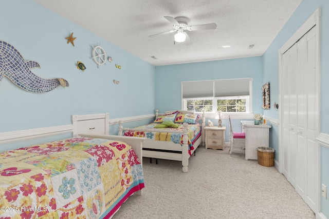 109 Lobster Ln, Emerald Isle, NC 28594 - bedroom with a textured ceiling, carpet flooring, ceiling fan, and a closet