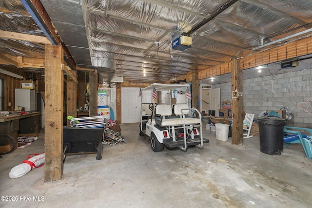 109 Lobster Ln, Emerald Isle, NC 28594 - garage featuring a garage door opener and concrete block wall