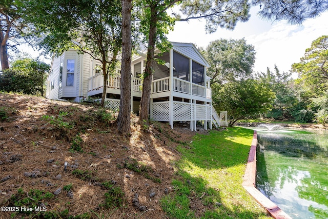 109 Lobster Ln, Emerald Isle, NC 28594 - back of property featuring a sunroom