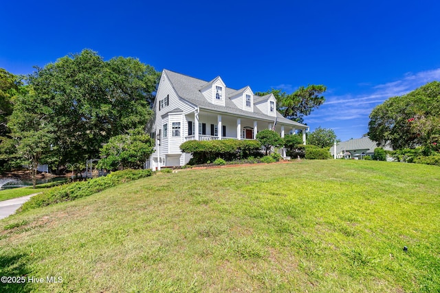 109 Lobster Ln, Emerald Isle, NC 28594 - new england style home with a porch and a front lawn
