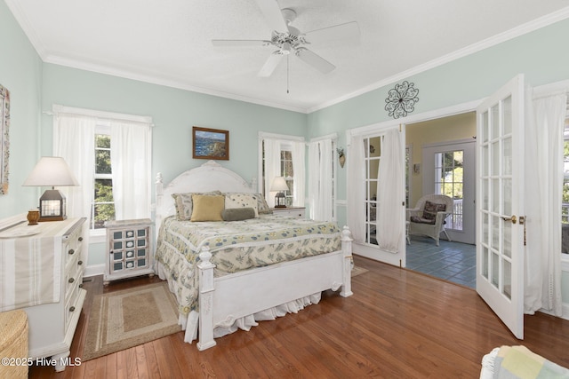 109 Lobster Ln, Emerald Isle, NC 28594 - bedroom featuring french doors, wood finished floors, multiple windows, access to exterior, and crown molding