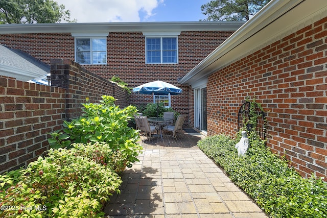 view of patio featuring fence and outdoor dining area