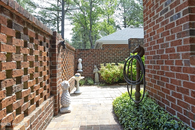 view of patio featuring fence