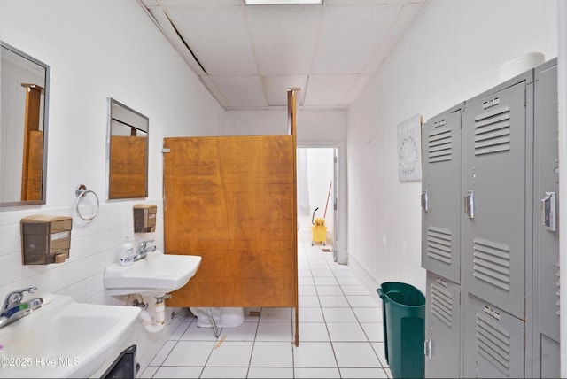 9291 NC-171, Williamston, NC 27892 - bathroom featuring a sink, a paneled ceiling, and tile patterned floors