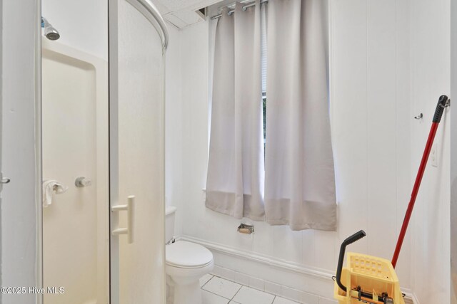 9291 NC-171, Williamston, NC 27892 - full bathroom featuring tile patterned floors, a shower stall, and toilet