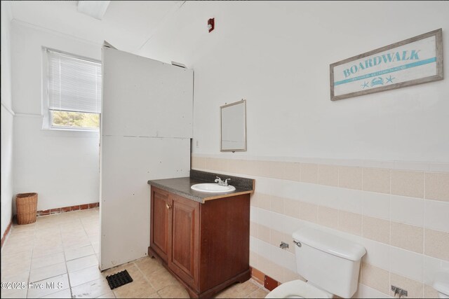 9291 NC-171, Williamston, NC 27892 - bathroom featuring vanity, toilet, and tile patterned flooring
