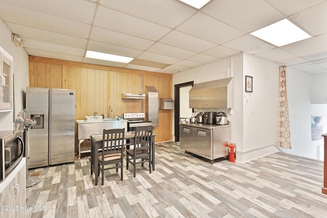 9291 NC-171, Williamston, NC 27892 - dining space featuring light wood finished floors, a drop ceiling, and wood walls