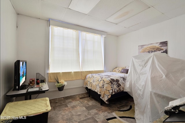 9291 NC-171, Williamston, NC 27892 - bedroom featuring a drop ceiling and stone finish floors