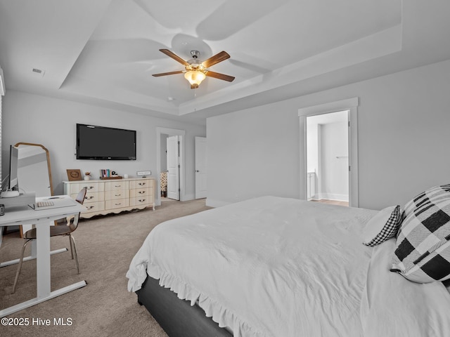 221 Salt Meadow Ln, Newport, NC 28570 - bedroom featuring a tray ceiling, light colored carpet, and ceiling fan