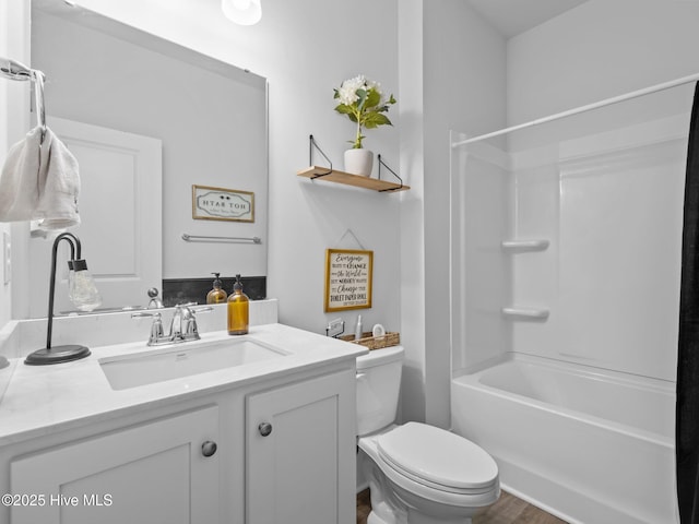 221 Salt Meadow Ln, Newport, NC 28570 - bathroom with toilet, vanity, wood finished floors, and shower / bathtub combination